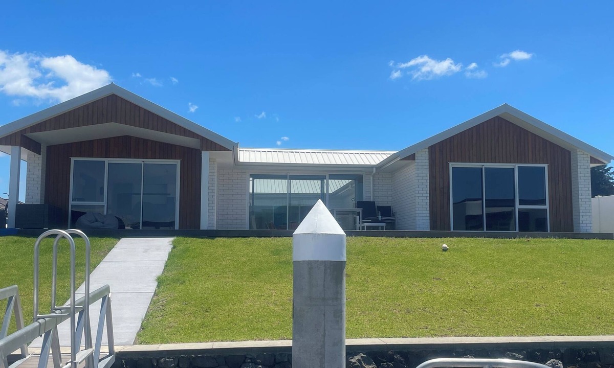 One Tree Point House | Brand new canal-front holiday home, stunning water views, private boat ramp.