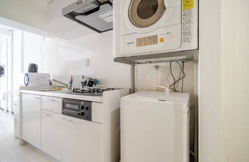 Naha City Centre Apartment | A queensize bed and a sofa bed make this a comfor/Naha Okinawa