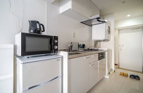 Naha City Centre Apartment | A queensize bed and a sofa bed make this a comfor/Naha Okinawa