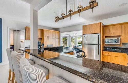 Bel Air House | Bay Breezes is a waterfront home in a gated community minutes from the beach.