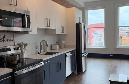 Central Business District Apartment | Bright Sunlit Studio in Downtown Rochester Floor-to-Ceiling Windows