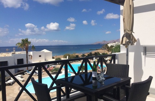 Puerto del Carmen Apartment | Front line, contemporary, stunning sea views, pool, WiFi, SKY