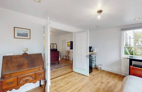 East Beach Apartment | Intimate retreat 1 block to beach with Cal king bed & bonus sleeping room