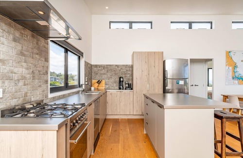 Langs Beach House | Langs Beach House - Modern, sunny holiday home with large decks and stunning views over Bream Bay