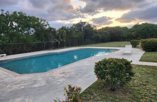 Bahamas Terrace Apartment | Tropical Poolside Getaway in Freeport