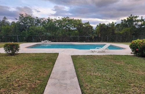 Bahamas Terrace Apartment | Tropical Poolside Getaway in Freeport