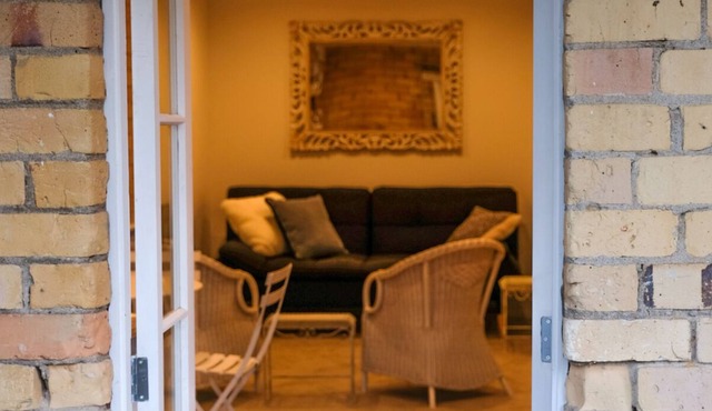 Central Devonport, French country meets heritage in this garden view apartment.