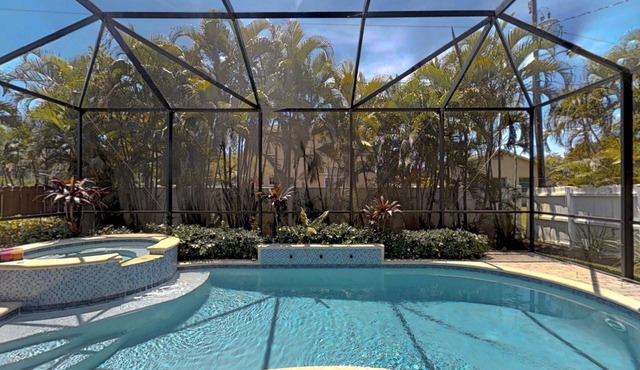 Two Master Bedrooms! Less than 1 Mile to the beach with heated pool and spa